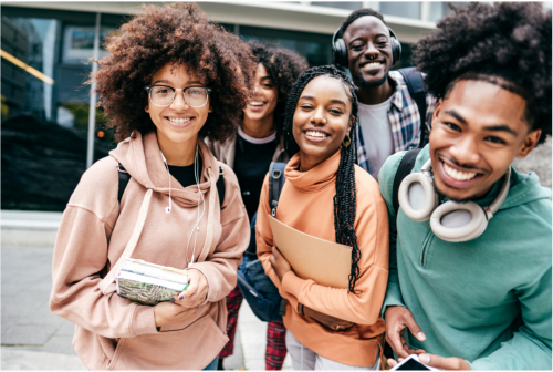A group of five students smiling at the camera.