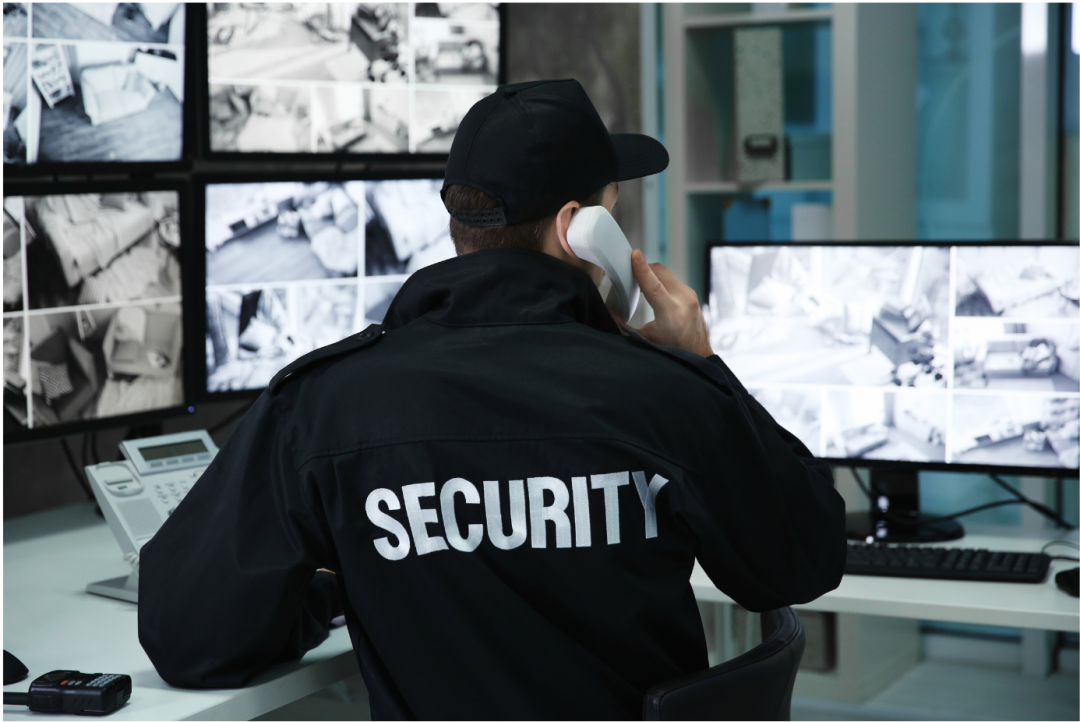 security guard looking at monitors corrections certificate program ec3
