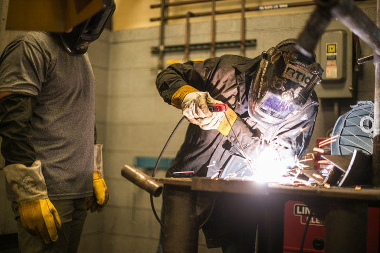 Teacher teaching student GTAW (TIG) Welding