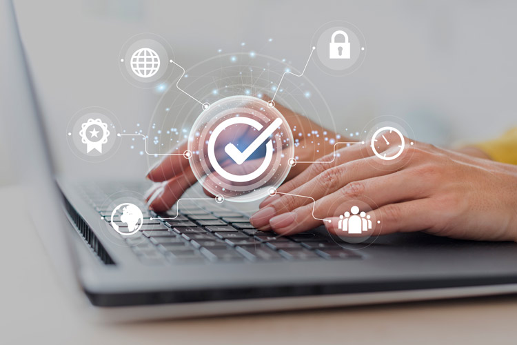 Hands on a keyboard with an overlay of cyber security icons to introduce the privacy policy on this site.